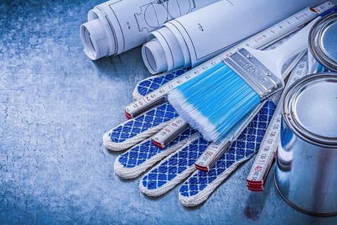 Composition of paint brushes cans wooden meter blueprints protective gloves
