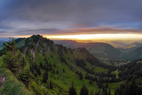 Panoramic view of a light and weather scene over the foothills of the Alps, taken from the