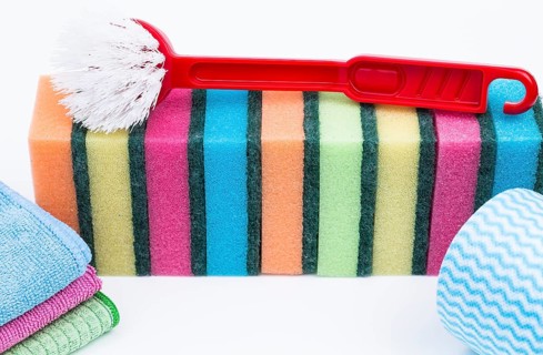 Various cleaning products against a white background