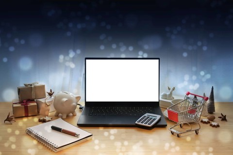 Laptop mockup, online sale offers like Black Friday, table with Christmas decoration, gifts,