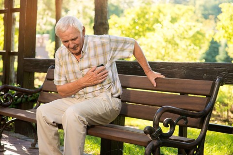 Senior guy has heartache. Elderly man on park bench. Too much stress. Chronic disease of heart