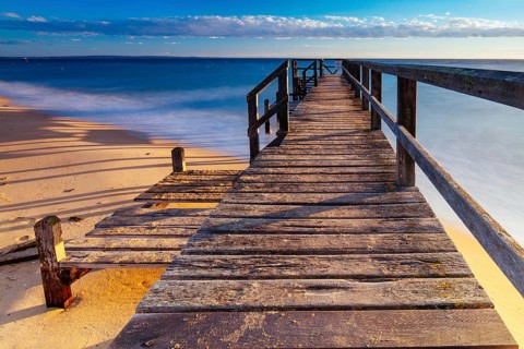 Piers near Millionaire's Walk at Point King Beach on a cool winter's morning at sunrise on the