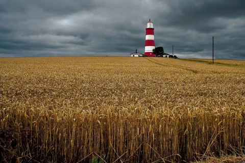 HAPPISBURGH, NORFOLK, UK - AUGUST 6 : Storm approaching the Lighthouse at Happisburgh in Norfolk on