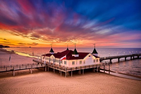 Morning time at baltic sea beach and sight Ahlbeck pier in sunrise