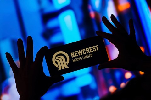 In this photo illustration, the Newcrest Mining Limited logo is displayed on a smartphone screen