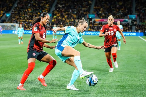 MELBOURNE, AUSTRALIA, JULY 31: Caitlin FOORD of Australia and Jayde RIVIERE of Canada tackle as