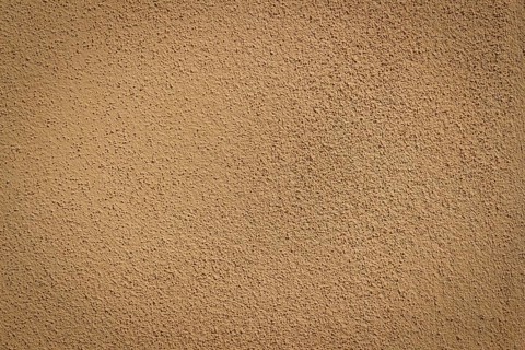 Orange wall background and texture with vignetting and blank copyspace for text or advertising