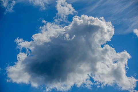 Large, dramatic cloud against a blue sky, creating both light and shadow, Mitterteich, Upper