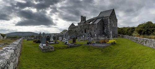 Ballyvaughan, Ireland, 28 July, 2022: panorama view of the historic 13th-century Corcomroe Abbey