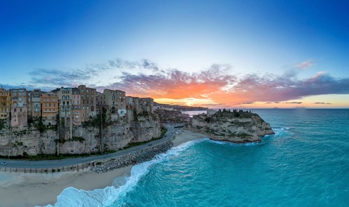 Tropea, Italy, 16 December, 2023: panorama view of Rotonda Beach and the colourful old town of