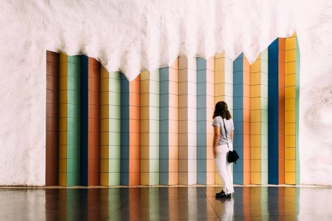 Stockholm, Sweden, August 9, 2019: Blurred motion woman looking at tile colorful pattern in
