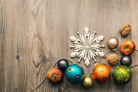 Christmas decoration glass balls on a wooden background