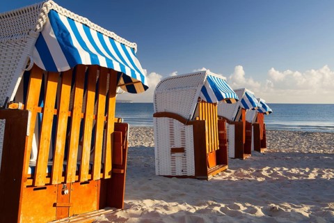 Sandy beach and traditional wooden beach chairs on Rugen island, Northern Germany, on the coast of