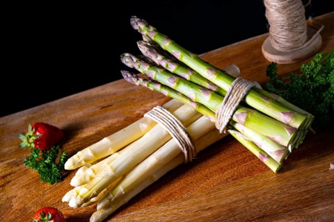 Green and white asparagus on the table