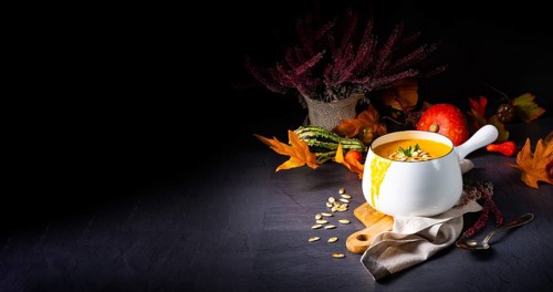 Cream of pumpkin soup with roasted pumpkin seeds and seed oil