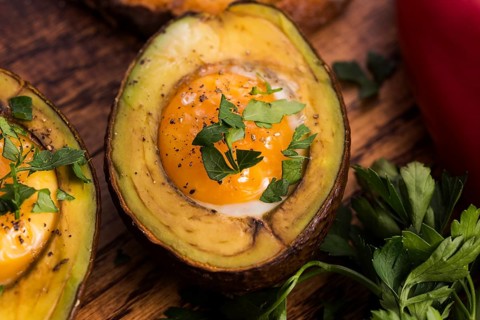 Homemade Organic Egg Baked in Avocado with Salt and Pepper