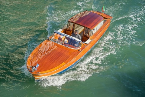 Wooden boat on the Grand Canal, possibly a Riva boat, Venice, Veneto, Italy, Europe