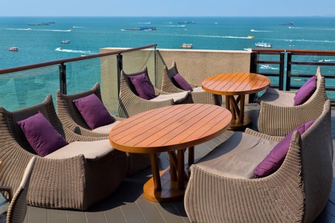 Empty table in a restaurant overlooking the sea