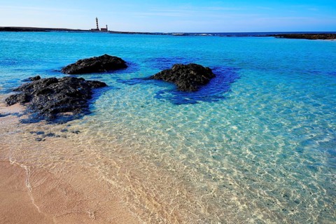 El Cotillo beach and Toston lighthouse at Fuerteventura Canary Islands