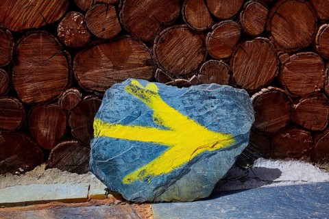 O Cebreiro by the way of Saint James in Galicia yellow arrow sign Spain