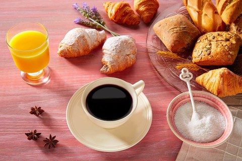 Coffe breakfast with orange juice croissant bread and yogurt