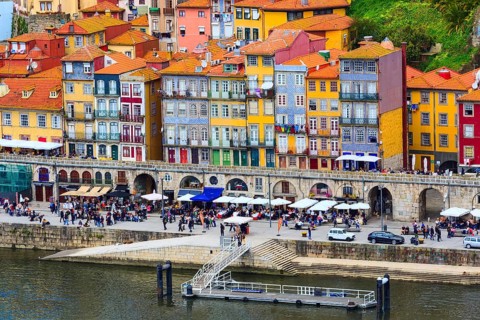 Porto, Portugal old town ribeira aerial promenade view with colorful houses near Douro river