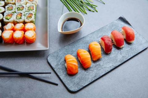Sushi Maki and Niguiri with soy sauce and California roll