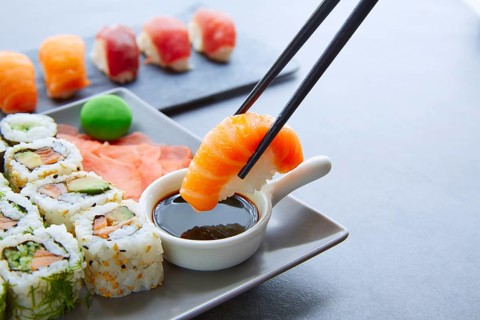 Sushi Maki and Niguiri with soy sauce and wasabi with California Roll
