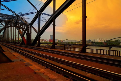 Berlin railway at Deutschherrnbrucke bridge over river Meno in Germany