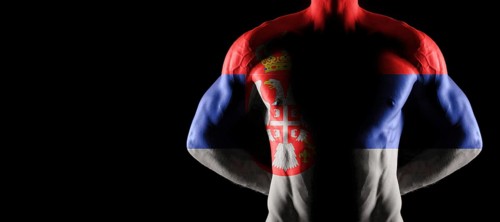 Serbia flag on muscled male torso with abs, black background