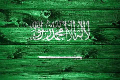 Saudi Arabia flag on wooden planks background wood flag