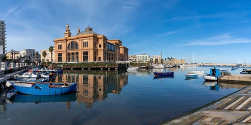 Bari, Italy, 27 November, 2023: view of the historic Teatro Margherita building and fishermen