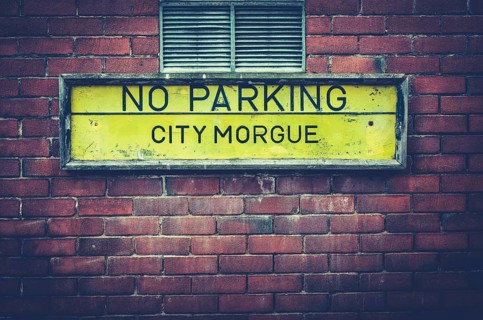 A No Parking Sign Outside A City Morgue In A US City