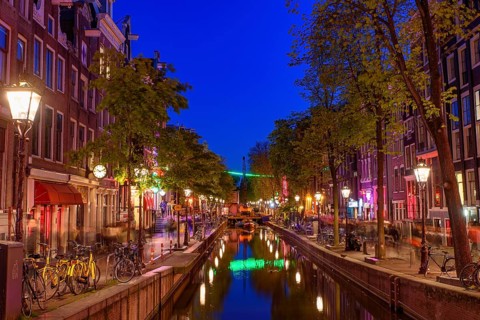 Night view of De Wallen, the famous red-light district with window prostitution in Amsterdam,