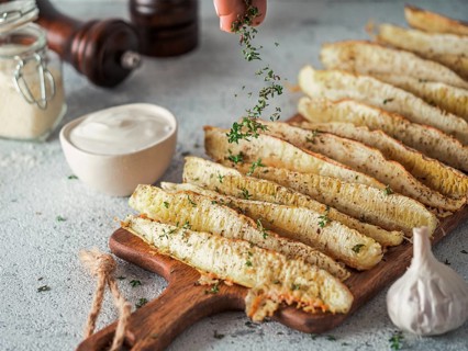 Baked Parmesan Garlic Zucchini. Thyme leaves fall on oven baked zucchini. Ideas and recipes for