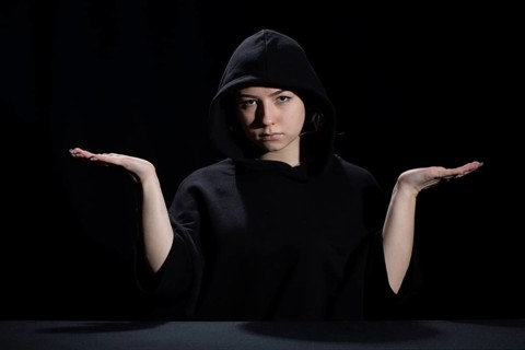 A young woman is waiting for the development of the situation in difficult conditions on the labor