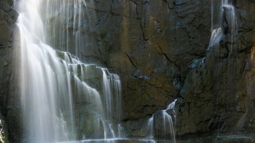 Detail of a waterfall in long exposure and rocky background, Australia, Oceania