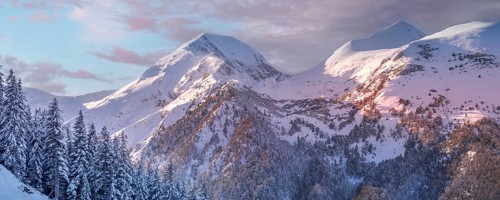 Pirin, Bulgaria winter travel vacation nature panoramic background with snow covered mountain peaks