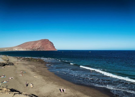 Las tejitas volcanic beach and montana roja landmark landscape in south tenerife spain
