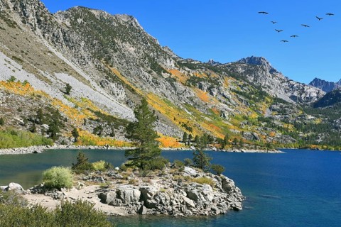 Fishing paradise. Azure lake in autumn mountains