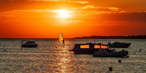 Atmospheric sunset by the sea Baltic coast Salzhaff