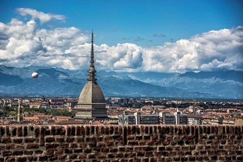 Panoramic view of Turin city center, in Italy, in a sunny day, with Mole Antonelliana and Alps in