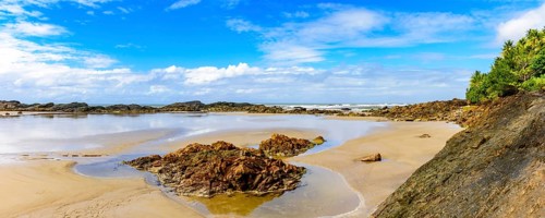 Panoramic image of beautiful Prainha beach located in Serra Grande in Bahia and surrounded by rocks
