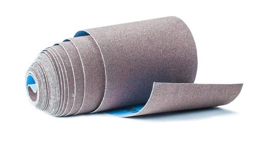 Rolled sandpaper abrasive tools isolated on white