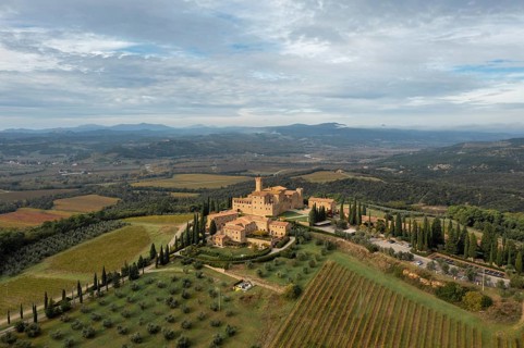Montalcino, Italy, 16 November, 2023: aerial view of the Poggio alle Mura Castle and Villa Banfi