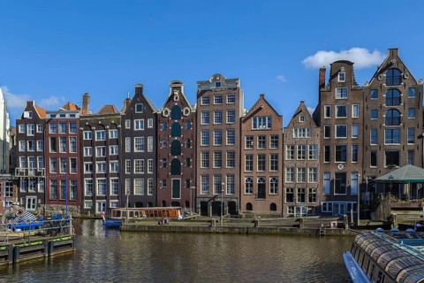The so-called dancing house on the canal Damrak in Amsterdam