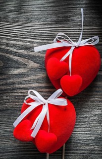 Red Valentine hearts on wooden board celebrations concept