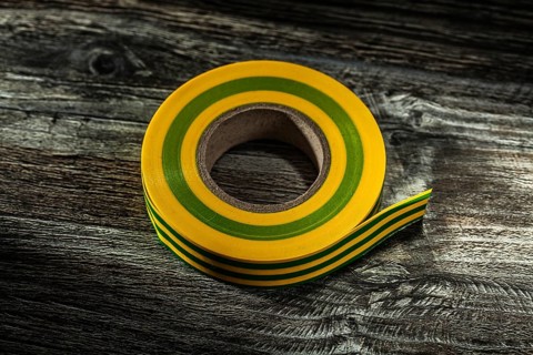 Rolled duct tape on vintage wooden board
