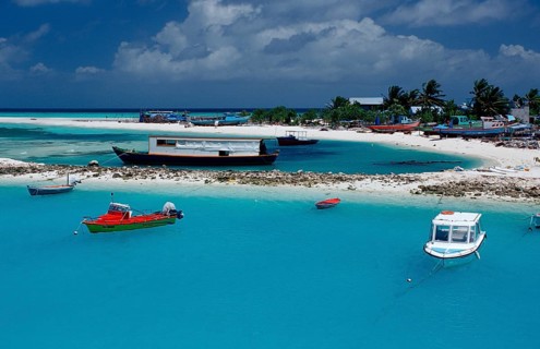 Fishing boats and dhonis off Maldives Island, Maldives, Indian Ocean, Meemu Atoll, Asia