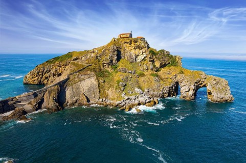 The island Gastelugache connected to the mainland by a bridge and a winding staircase. The Bay of